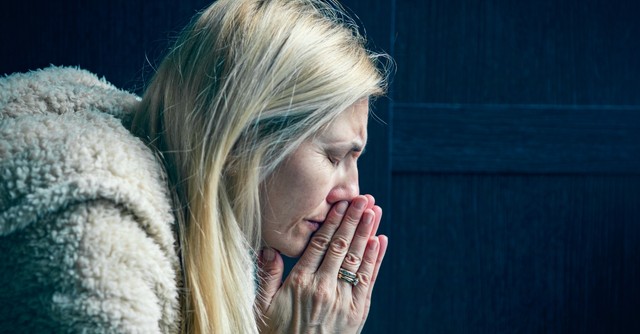 Woman praying in earnest