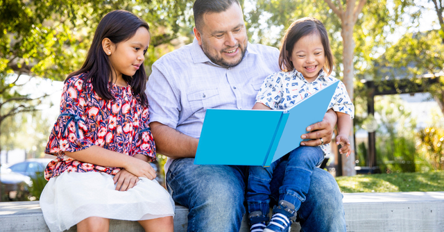 Dad reading to his kids