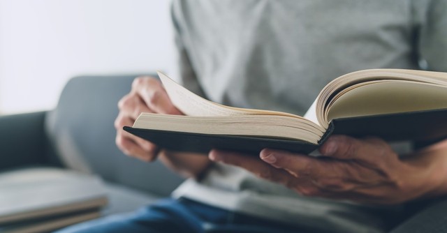 man reading books