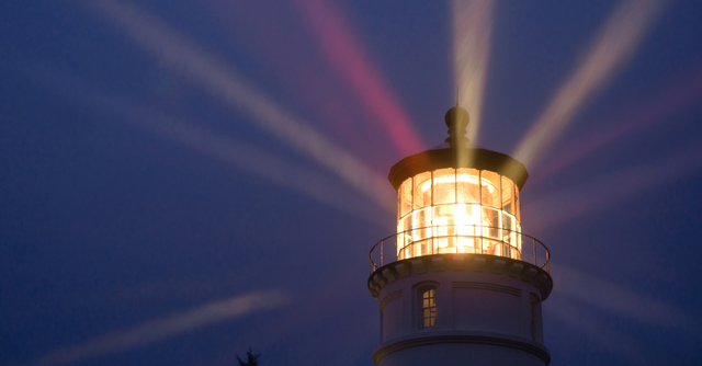 Lighthouse shining at night; shine your light before others.