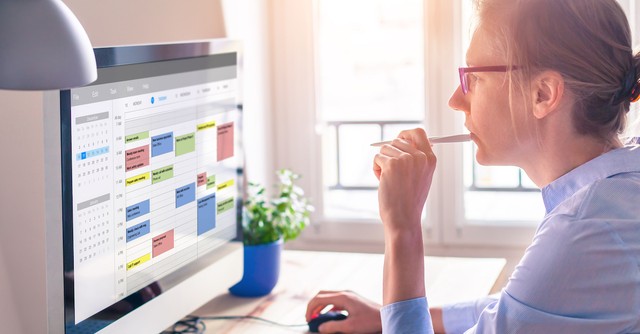 Woman on computer planning schedule