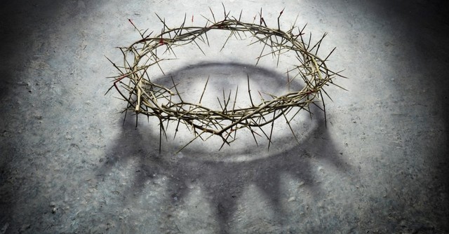 crown of thorns with a king's crown shadow