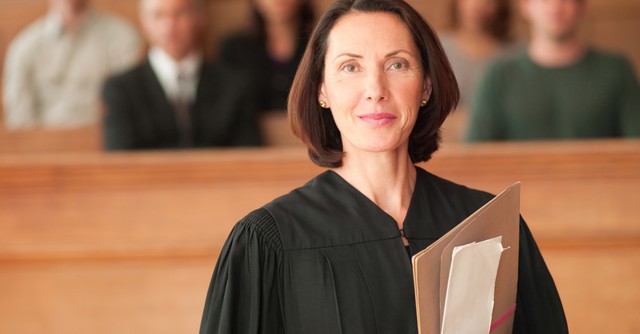 A female judge looking at the camera