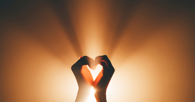 Hands lifted in prayer or open toward light