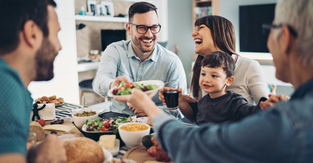 Family sharing a meal around a dining table