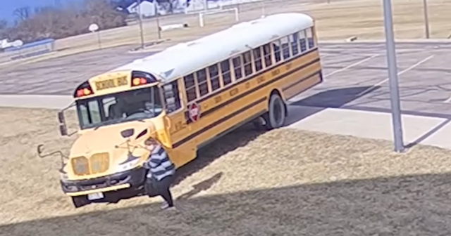 a woman approaching a bus off the road