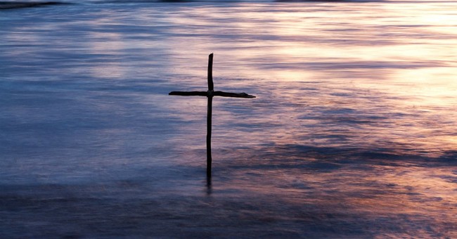 cross in water baptism concept