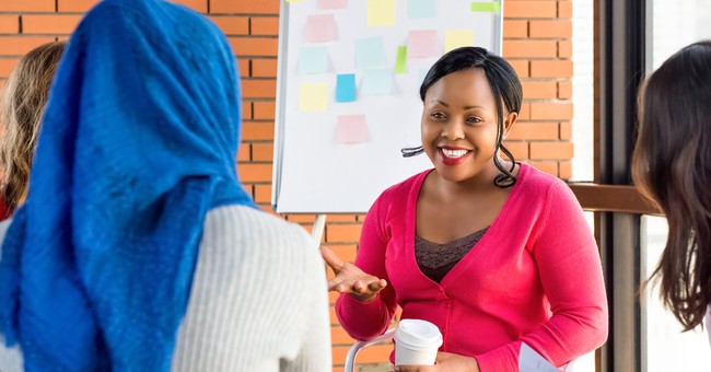 group of diverse women of different faiths conversing