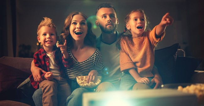 family watching a movie looking excited, classic family movies with gospel themes