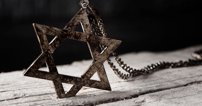 star of David on chain burned to signify holocaust