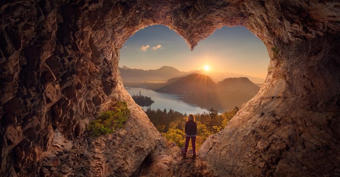 gift of God's eternal life, woman standing in a cave looking out on a lake