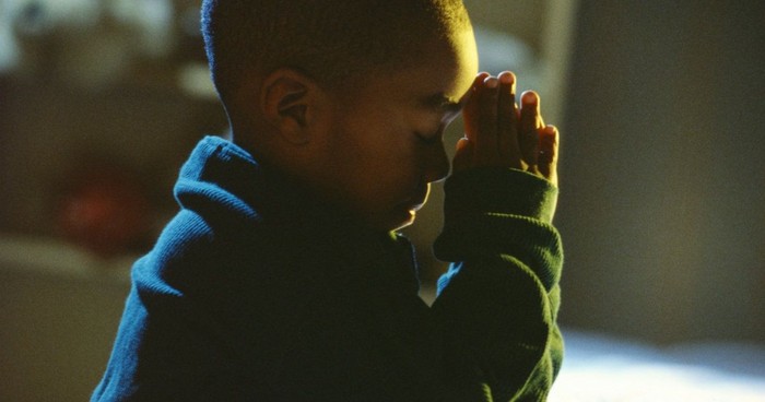 black baby praying