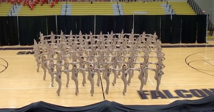 Dancers Fall to the Floor and Then Mesmerize Everyone with Synchronized High Kick Routine