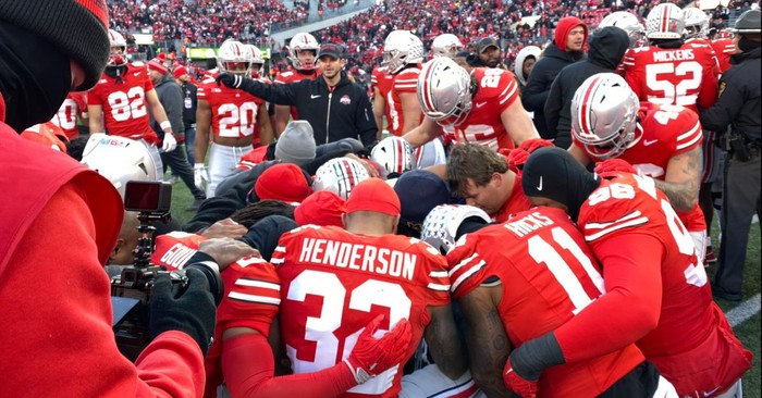 Michigan and Ohio State Players Turn to Prayer during Post-Game Chaos