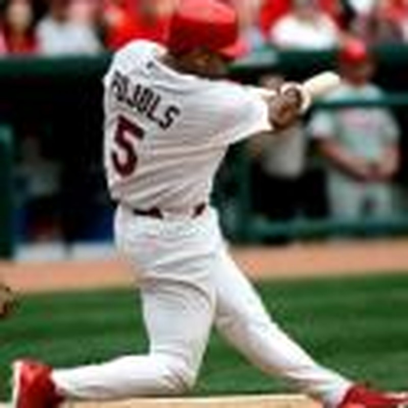 St. Louis Cardinals Albert Pujols (C) along with wife Deidre and