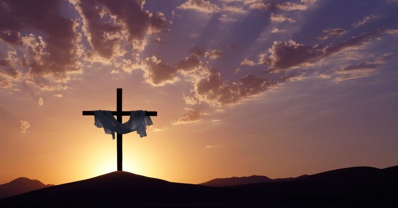 Cross with white fabric at sunset, nothing to worry about