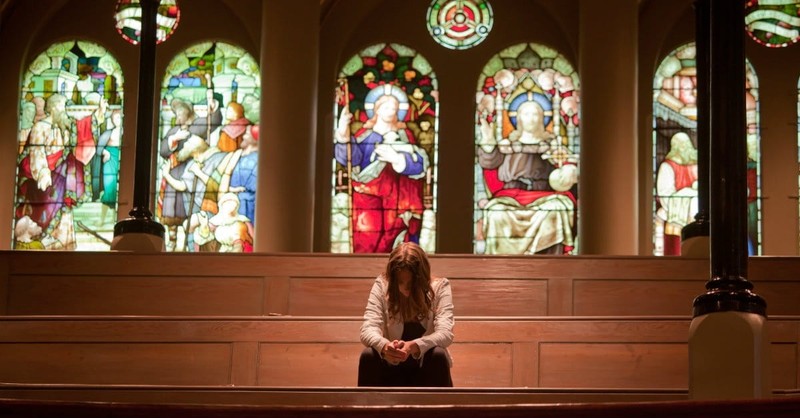 family praying in church