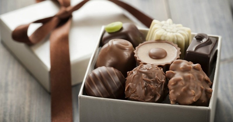 9. Leave her a box of chocolates on her nightstand with a note from the heart.