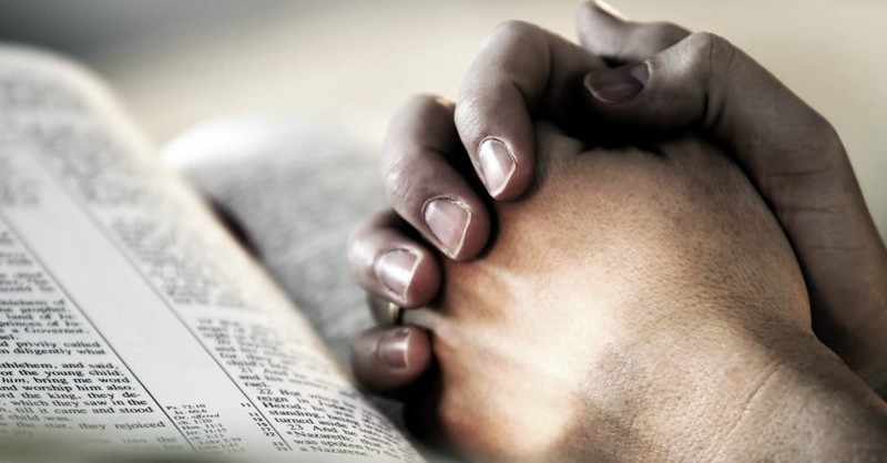 hands together in prayer with bible, prayer closet