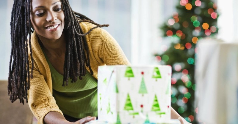 Mother Gives a Gift To Her Son for Christmas or Son Gives a Gift