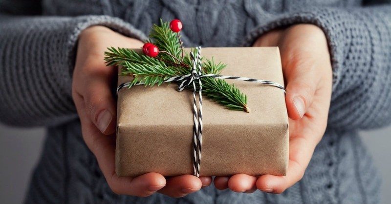 person holding wrapped present, what does the Bible say about presents