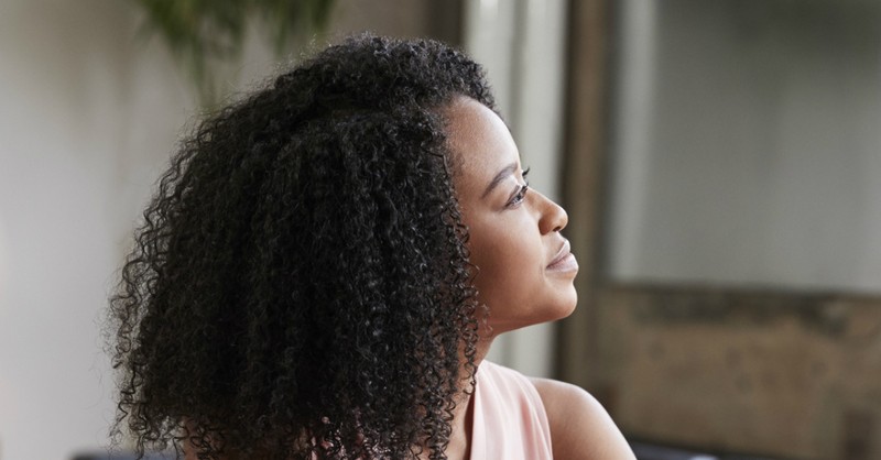 woman looking thoughtful in the distance