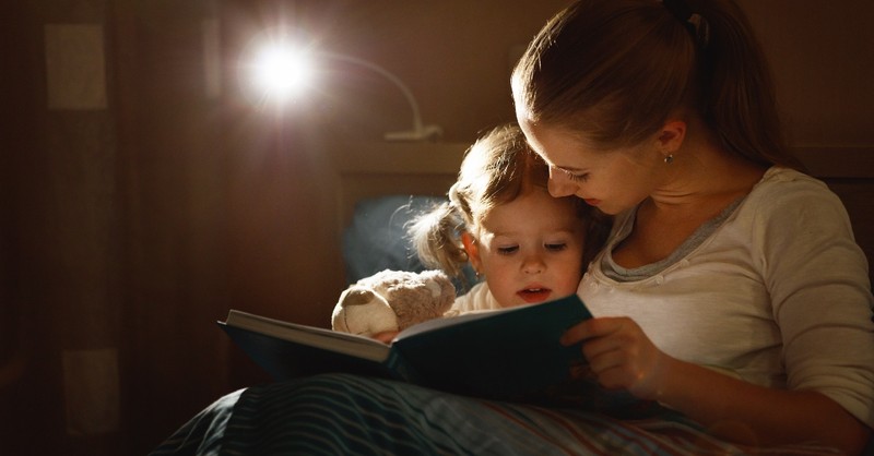 mother reading to daughter