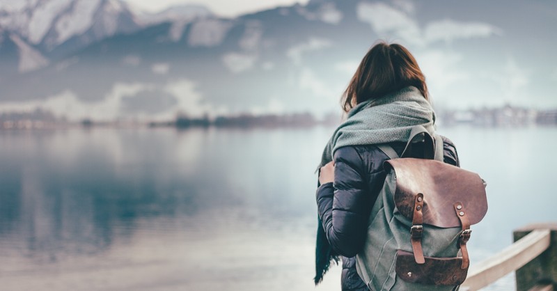 woman looking off at the distant mountains