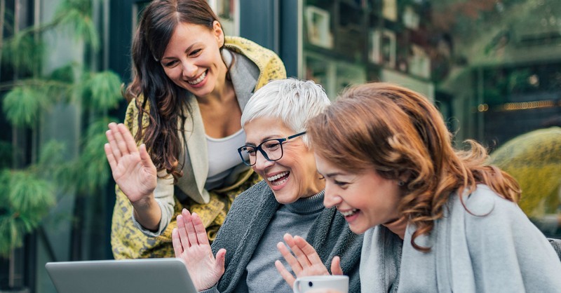 women greeting someone in video chat