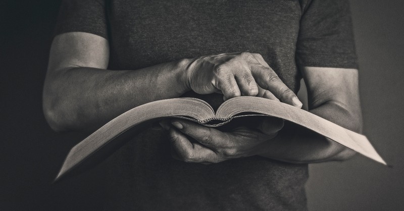 Pastor reading a Bible