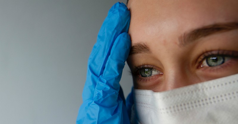woman in distress wearing face mask and gloves coronavirus quarantine
