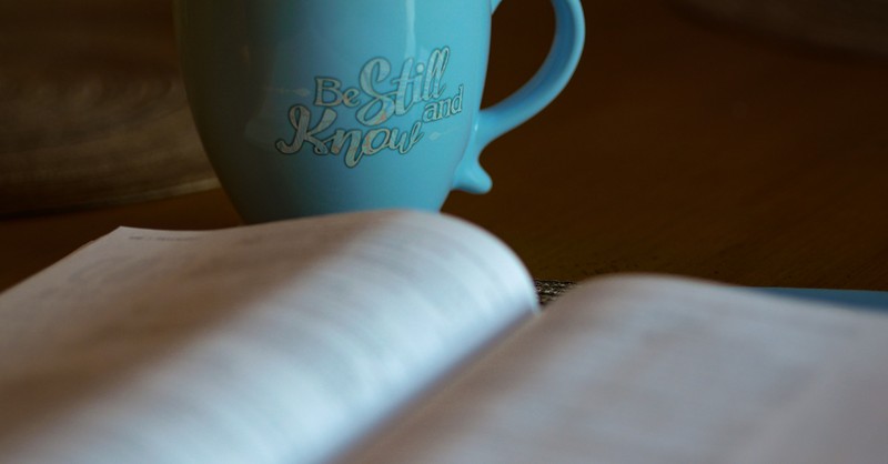 bible with coffee be still and know
