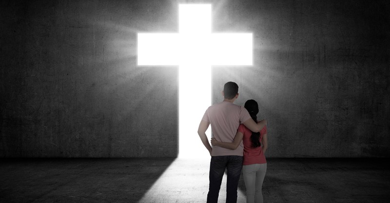 godly couple by the cross