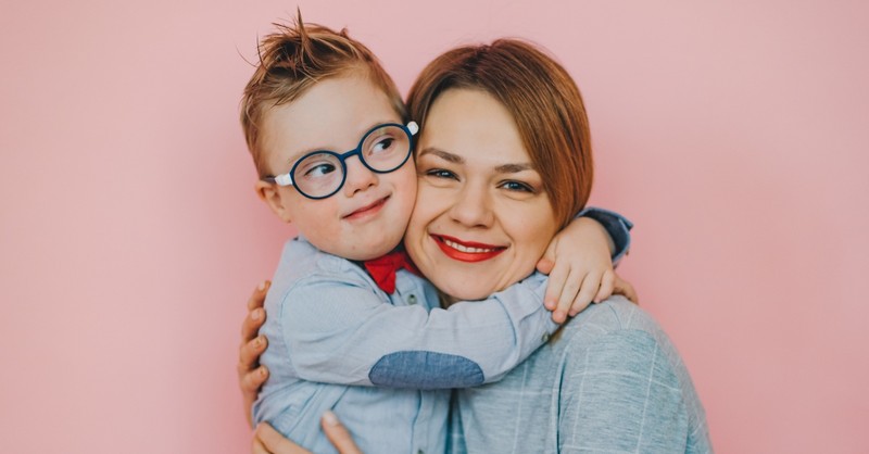 Mom posing with her young son