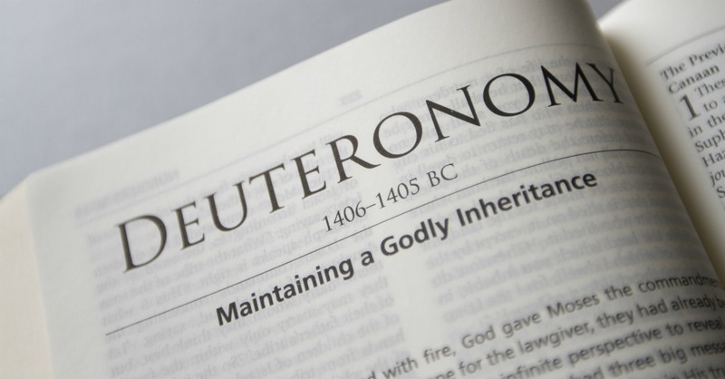bible open to beginning of the book of deuteronomy