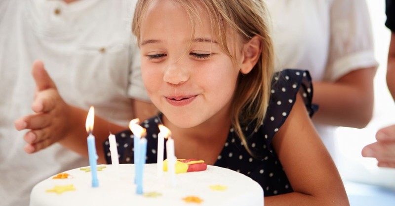 little girl blowing out birthday candles prayer