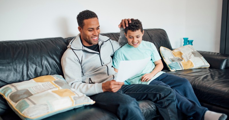 dad and son on couch affirmation fathers day