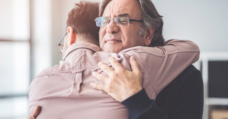 adult son hugging dad fathers day forgiveness, relationships dysfunction