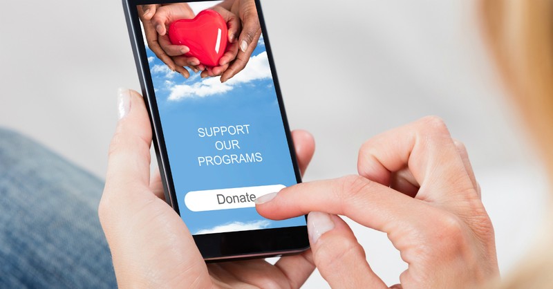 woman donating on cell phone