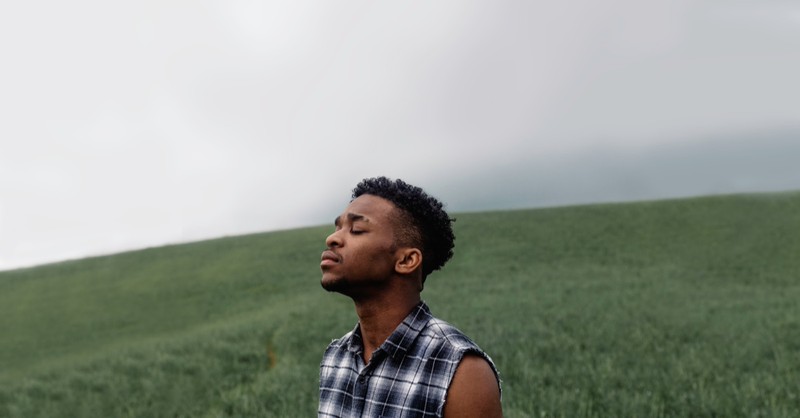 A young black man praying, Why we must choose to change