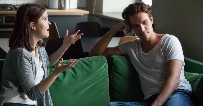 upset couple fighting on couch