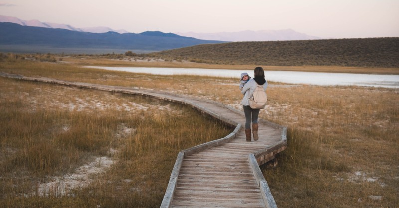 mom walking on a path hiking