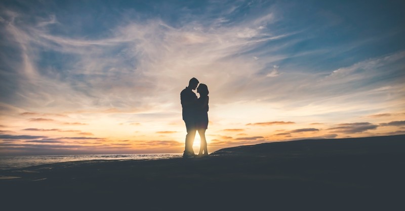Silhouette of couple hugging