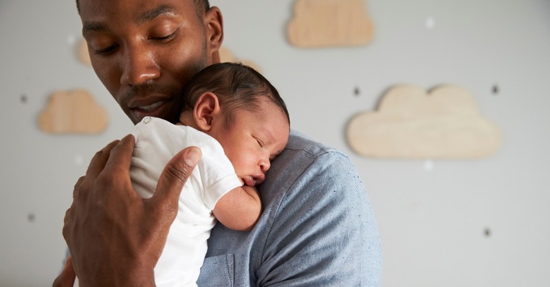 dad holding infant baby asleep on his shoulder, generational sin