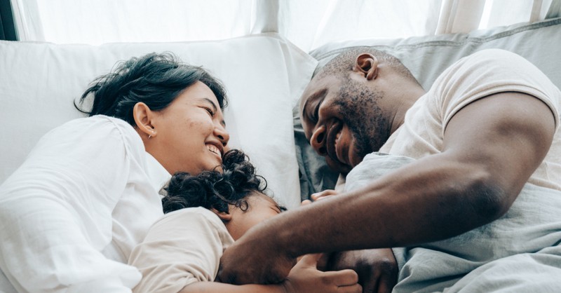 happily family relaxing on Sabbath in bed