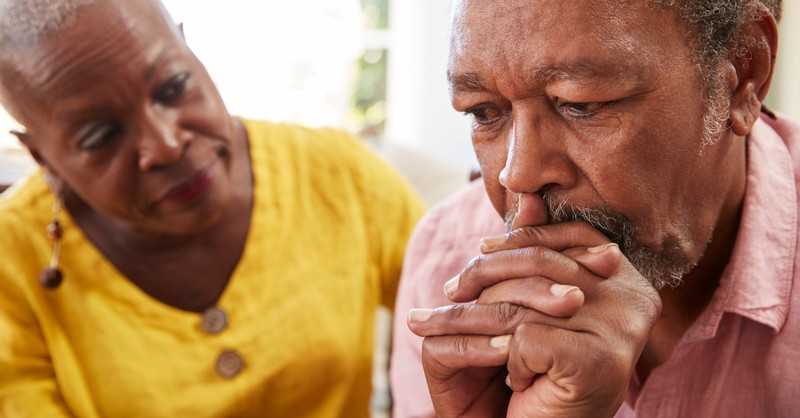 senior wife looking concerned at troubled husband, prayer for spouse who won't communicated