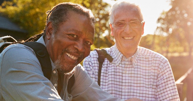 two senior men friends on hike