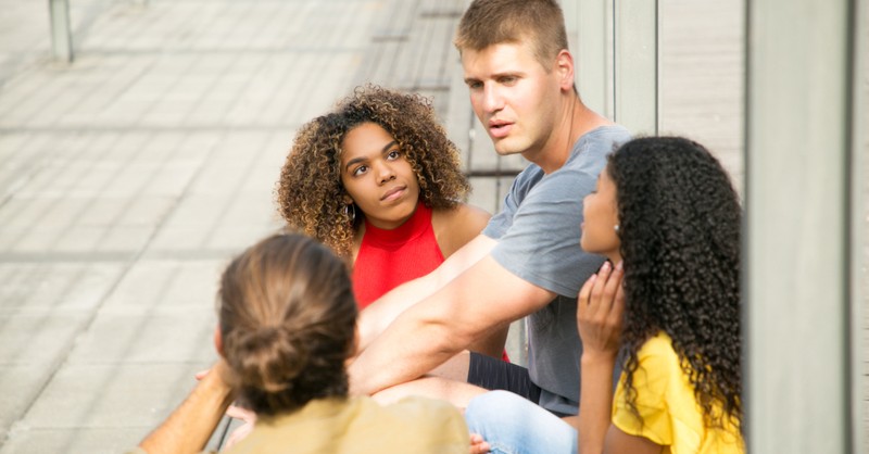 group of friends having serious discussion conversation, reasons uncomfortable talking about race
