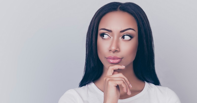 woman looking sneaky and thinking