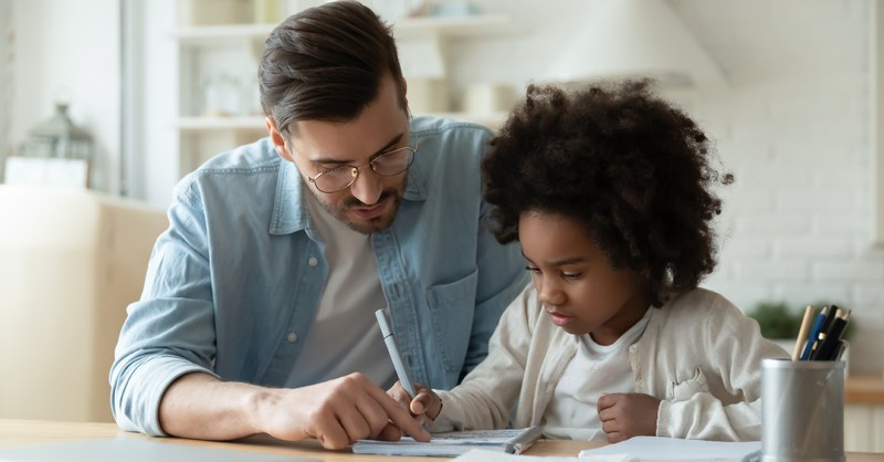 dad helping kid with homework